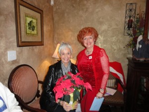Bonnie received a beautiful poinsettia from Co-Licensees Phyllys Ransom and Annette Walden Mason. She's pictured here with Phyllys. #JOC